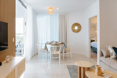 Design ideas for a small beach style living room in Sunshine Coast with white walls, ceramic floors, a wall-mounted tv and panelled walls.