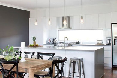 Photo of a modern kitchen in Gold Coast - Tweed with an undermount sink, quartz benchtops and white splashback.