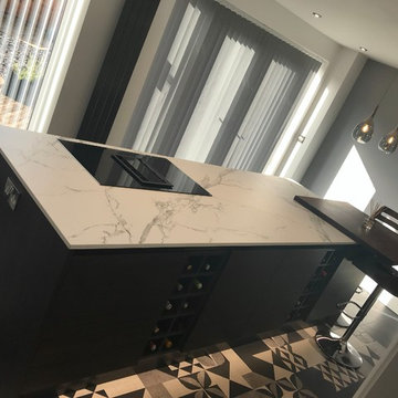 Contemporary grey scale handleless kitchen