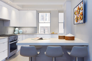 Inspiration for a large modern l-shaped gray floor eat-in kitchen remodel in New York with an undermount sink, flat-panel cabinets, white cabinets, quartz countertops, blue backsplash, glass tile backsplash, stainless steel appliances, an island and white countertops