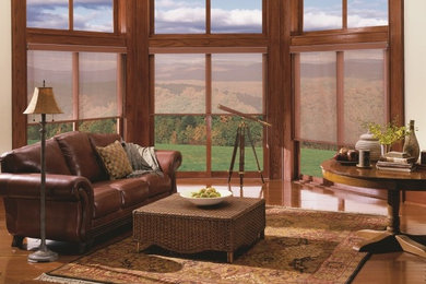 Mid-sized mountain style formal and enclosed dark wood floor and brown floor living room photo in Seattle with white walls and no tv