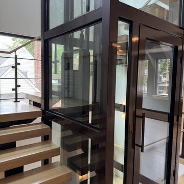 Project #136 | Modern Floating Staircase Encircling Glass Elevator