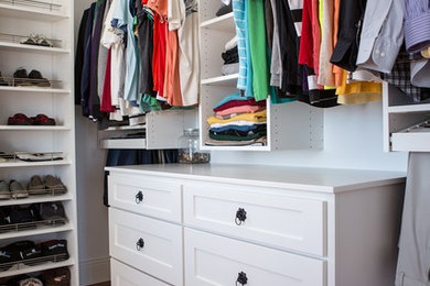 Example of a large transitional gender-neutral dark wood floor walk-in closet design in Cedar Rapids with shaker cabinets and white cabinets