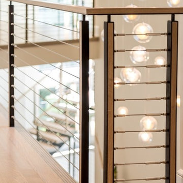 Vaddi - floating double steel center stringer with cable railing