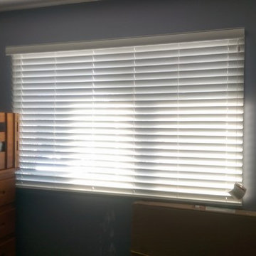 Faux wood blinds in a bedroom