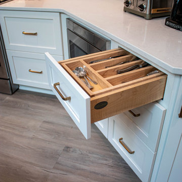 3 Finishes on Kitchen Cabinetry with Galley Workstation in Island and Wine Bar