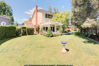 Mid-sized southwest beige two-story exterior home photo in San Francisco with a hip roof