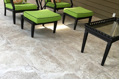 Inspiration for a mid-sized contemporary backyard tile patio remodel in Indianapolis with no cover