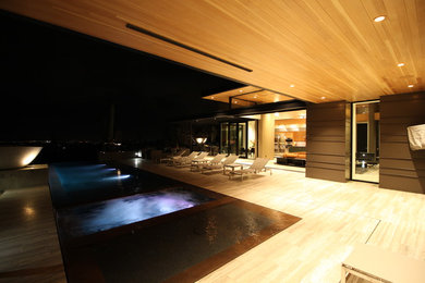 Pool - large contemporary backyard rectangular pool idea in Phoenix