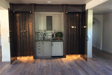 Inspiration for a large craftsman wine cellar remodel in Phoenix