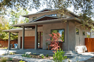 Example of a large trendy gray two-story concrete exterior home design in San Francisco with a tile roof