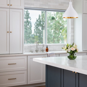 Two-Tone Cabinetry with Subway Tile Backsplash