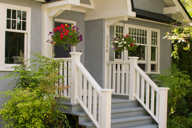 Inspiration for a timeless gray stucco exterior home remodel in Vancouver