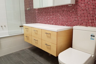 Inspiration for a small modern master bathroom in Sydney with furniture-like cabinets.