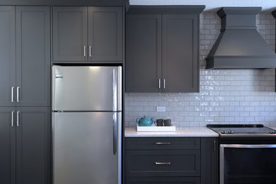Inspiration for a contemporary kitchen remodel in Calgary with shaker cabinets and gray cabinets