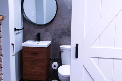 Example of a trendy powder room design in Toronto