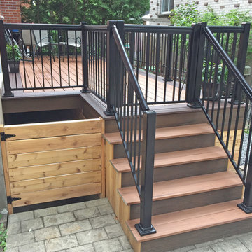 Tiki Torch Decking With Lava Rock Picture Frame and Cedar Wood Skirting