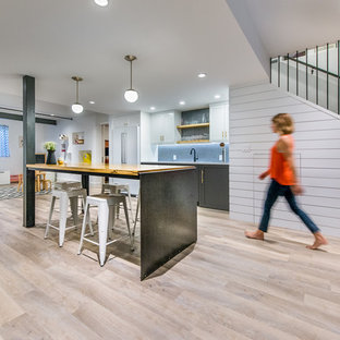 Example of a transitional home design design in Denver