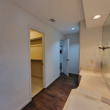 Two separate bathrooms converted into a master bathroom with a big open closet