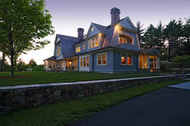 This is an example of a large traditional three-storey grey exterior in Boston with wood siding and a hip roof.