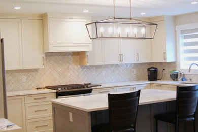Kitchen - coastal u-shaped kitchen idea in Vancouver with shaker cabinets, gray cabinets and an island
