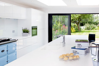 Large modern open plan kitchen with white cabinets and an island.