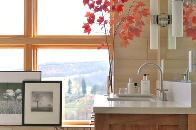 Transitional bathroom photo in Other with flat-panel cabinets, medium tone wood cabinets, solid surface countertops and beige walls