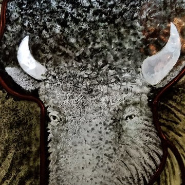 Glass painted detail of Buffalo Head.