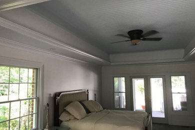 Inspiration for a large contemporary master bedroom remodel in Other with white walls and no fireplace