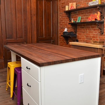 Bourbon, IN. Haas Signature Collection. Farmhouse Kitchen with Exposed Brick