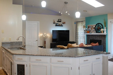 Kitchen - transitional u-shaped kitchen idea in Jacksonville with shaker cabinets, white cabinets and granite countertops