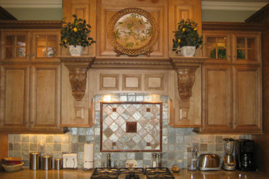 Example of an eat-in kitchen design in Louisville with beaded inset cabinets, light wood cabinets and multicolored backsplash