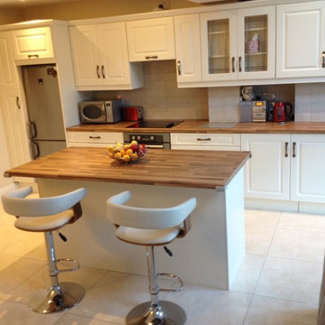 Ivory Vinyl, hammered pewter handle, walnut butcher block work top.