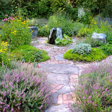 Herb Garden with recirculating serpentine water feature and brickand flagstone