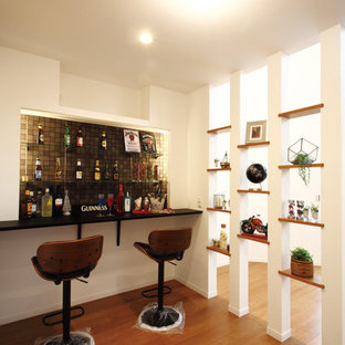 Inspiration for a contemporary single-wall breakfast bar in Other with plywood flooring and brown floors.
