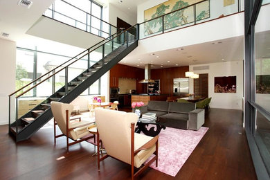 Example of a large trendy formal and open concept dark wood floor living room design in Houston with white walls, no fireplace and no tv