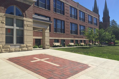 Photo of a large traditional full sun front yard brick garden path in Burlington for summer.
