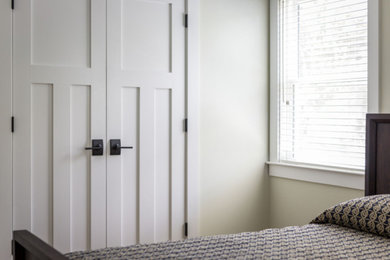 Example of a farmhouse bedroom design in Charleston