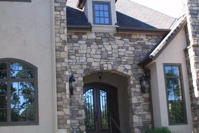 Large traditional beige two-story mixed siding house exterior idea in Sacramento with a hip roof and a shingle roof