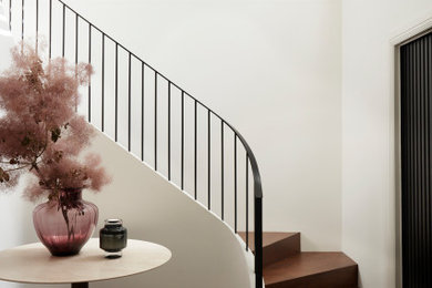 Inspiration for a mid-sized contemporary wood l-shaped staircase in Sydney with wood risers and metal railing.