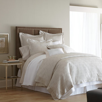 Neutral Bedding with a Brown Headboard