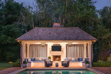 Example of a large classic backyard rectangular and brick pool design in San Francisco