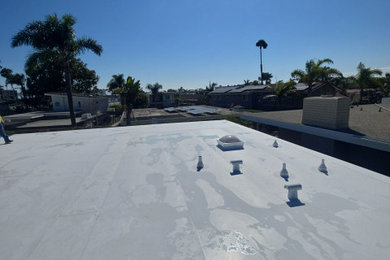 Mid-sized 1950s white one-story exterior home photo in Orange County with a white roof