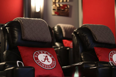 Example of a mid-sized classic enclosed carpeted home theater design in Tampa with gray walls and a media wall