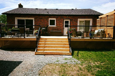 Deck - small rustic backyard deck idea in Other