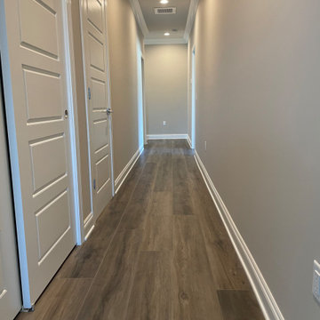 Beautifully installed 9x60 Luxury Vinyl Plank with a painted beveled edge