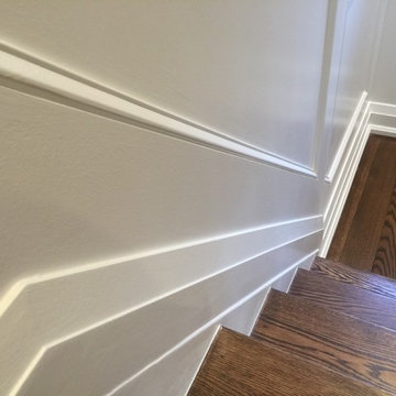 Espresso Stained Oak Staircase w/ Wainscoting, doors & trim