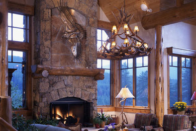 Example of a large mountain style formal and open concept living room design in Other with beige walls, a standard fireplace, a stone fireplace and no tv