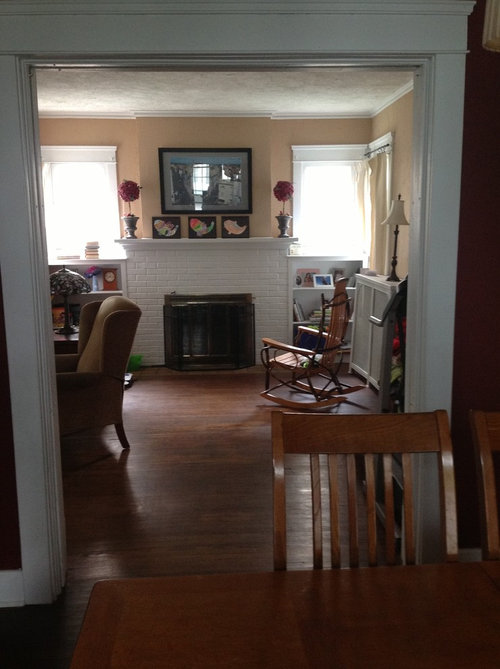 Long living room with oddly placed fireplace