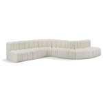 Meridian Furniture - Arc Vegan Leather Upholstered 7-Pc. S-Shaped Modular Sofa, Cream - Unleash modern opulence with the Arc Vegan Leather 7pc. Sectional. Crafted for the modern connoisseur, this Sectional injects an air of refined luxury into any space. Its sleek silhouette, upholstered in supple cream vegan leather, exudes timeless sophistication while the deep channel tufting adds textural intrigue, further elevating the chair's visual appeal. The modular design makes it a versatile chameleon, effortlessly adapting to your evolving needs and preferences. Whether you envision it gracing a chic living room corner, basking in the glow of a bedroom window, or adding a touch of drama to a home office, the Arc seamlessly complements your unique interior aesthetic.